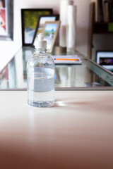 wash hand alcohol gel or sanitizer bottle dispenser on the office. Hygiene and Health concept