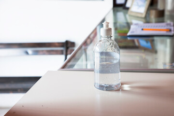 wash hand alcohol gel or sanitizer bottle dispenser on the office. Hygiene and Health concept