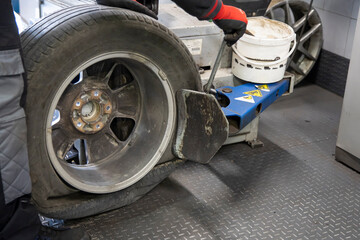 Mechanic removing a tire.