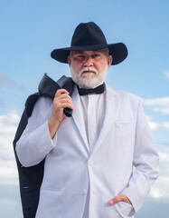 Handsome fashion senior old mature man. Elderly mature greybeard. Close up face portrait of senior....