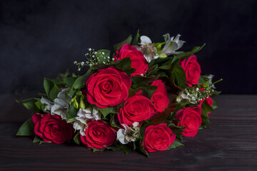 Arrangements red roses, white Alstroemeria, Gypsophila elegans in bouquets. Festive decoration.