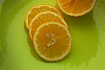 
Lemon sliced on a green plate