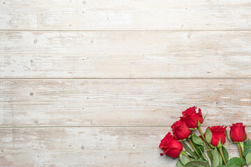 Naklejka na ściany i meble Red roses in bouquets, wooden surface. Layout for postcards, invitations for Valentine's Day 14 february, Engagement, wedding anniversary, Birthday, romantic evening preparation