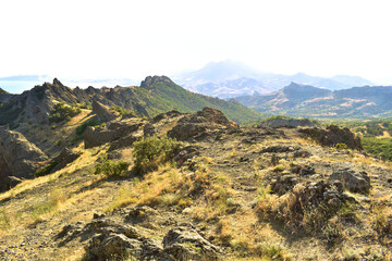 mountain peaks shot against the sun on a bright sunny day