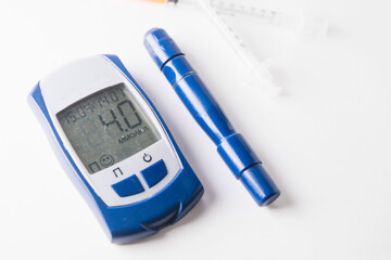 blood glucose meter on a white background. diabetes mellitus.