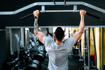 bodybuilding details and fitness workout. Man in sport gear working out at gym