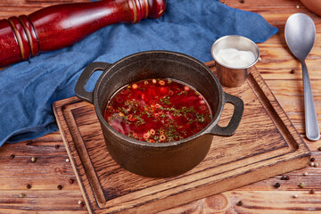 Beet soup, ukrainian cuisine, wooden background