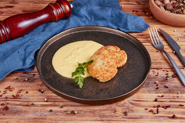 Chicken schnitzel with mashed potatoes, wooden background
