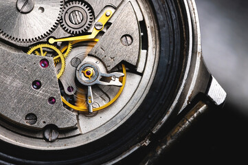 Opened mechanism of mechanical old wrist watch close up