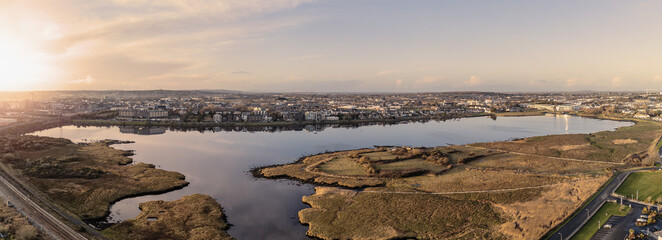 Panorama image of Lough Atalia in Galway city, Ireland. Sunset time. low sun and clean sky. Aerial...