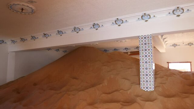 Sand Dune Reaches The Ceiling Of Abandoned Home In Al Madam Ghost Town