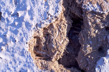 A huge crack in a clay wall