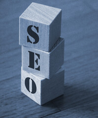 Text seo on a wooden cube blocks. SMM targeting copywriting web marketing concept