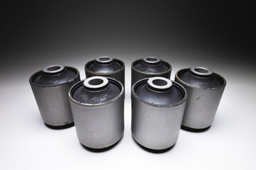 Close-up. A group of cylindrical silent blocks for the rear suspension of an off-road vehicle....
