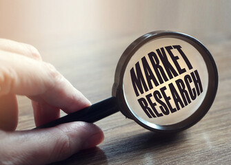 Market research under magnifying glass. Business concept