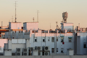 
photos of building from rooftop at sunset