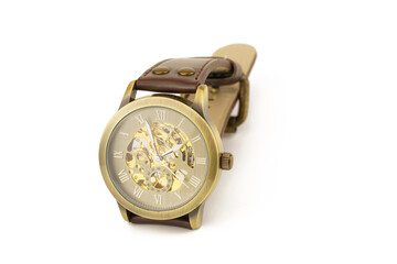 Mechanical wrist watch with brown strap on white