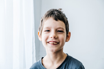Happy autism boy wearing a toy crown and smile. Life style autism inclusion and autism awareness...