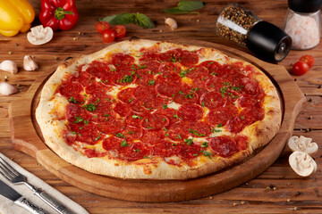 Pizza, variant of classic Italian pizza, wooden background