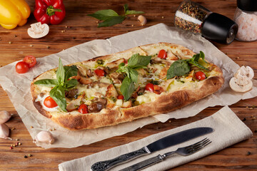 Roman pizza, variant of classic Italian pizza, wooden background