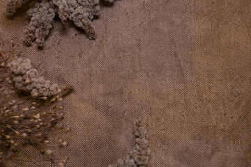 burlap with dried flowers, background