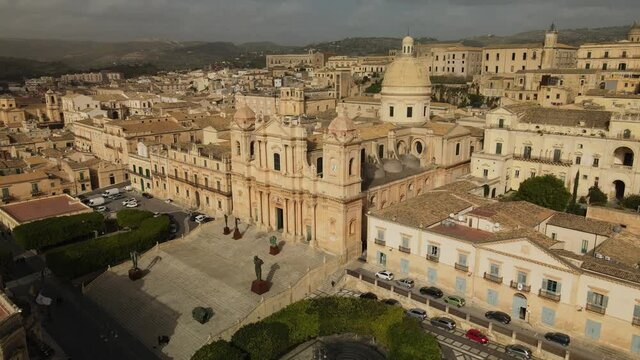 Aerial view of Cathedral of Noto (La Chiesa Madre di San Nicol&ograve;), UNESCO world heritage site and example of sicilian baroque. Drone flies above the Cathedral of Noto in the central street