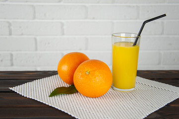 oranges and a glass of juice on the table