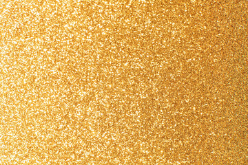 Abstract golden yellow and orange glitter lights background. Circle blurred bokeh. Festive backdrop for Christmas, holiday or event
