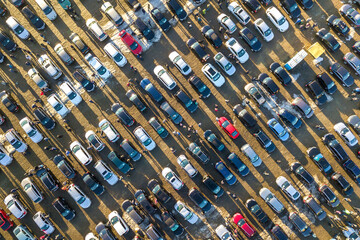 Aerial drone image of many cars parked on parking lot, top view.