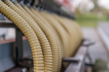 Close up of row of industrial hoses