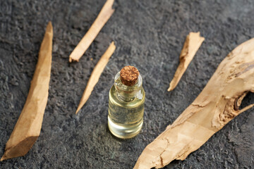 A bottle of essential oil with white sandalwood