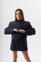 Fototapeta premium portrait of young attractive asian woman with long hair wearing blue suit on the contrary, isolated on white studio background. skinny pretty female posing on cyclorama. model tests of beautiful lady