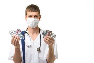 Portrait of doctor with medications in hands, isolated on white background