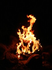 Blurred natural flame, the texture of the campfire at night, strong flames, flame background