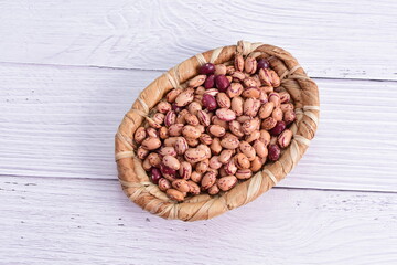 Natural bean grains, Phaseolus vulgaris on wooden background with light veins