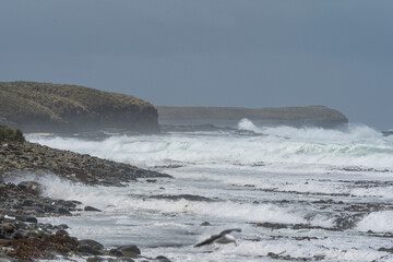 Waves crashing on a cliff