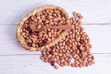 Natural bean grains, Phaseolus vulgaris on wooden background with light veins