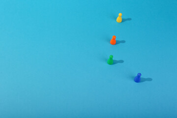 playing figures on a blue background with copy space. society concept