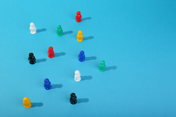 playing figures on a blue background with copy space. society concept
