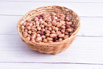 Natural bean grains, Phaseolus vulgaris on wooden background with light veins