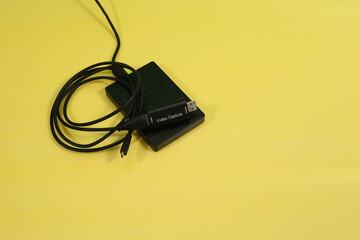 Closeup of live streaming essential tools isolated on a yellow background with copy space