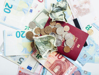 Cash on table isolated: dollars, euro, rubl broken money. All in mess, global crisis . passport travel concept