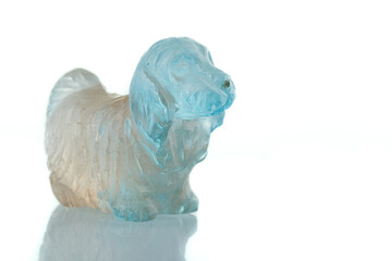 beautiful statuette of a dog from the mineral topaz on a white background