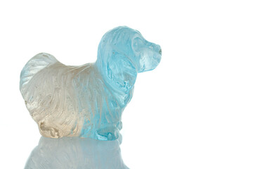 beautiful statuette of a dog from the mineral topaz on a white background