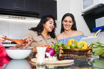 latin women cooking vegetables food and having fun in a mexican kitchen in Mexico city