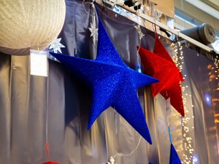 large Christmas hanging stars in blue and red 