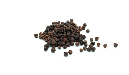 Black peppercorns on a white background. Close-up. The most famous classic spice.