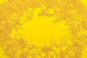 pasta in the form of circles on a yellow background. panel. texture. space for text