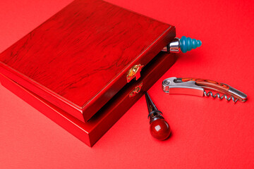 Wine corks and bottle openers set in a wooden box.