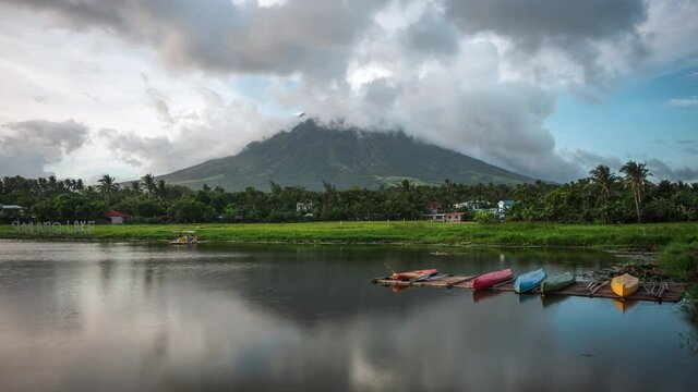 Legazpi, Albay, Philippines, time lapse view of Mount Mayon Volcano and Sumlang Lake at sunset.